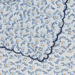 Close up view of little flowers rectangular tablecloth in blue.