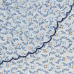 Close up view of round little flowers tablecloth in blue