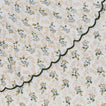 Close up view of little flowers tablecloth in green