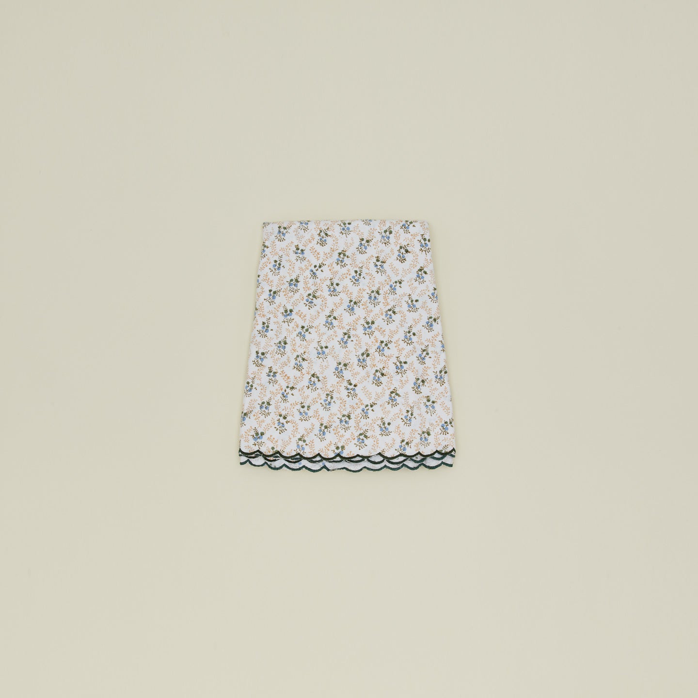 Little flowers round tablecloth in green.
