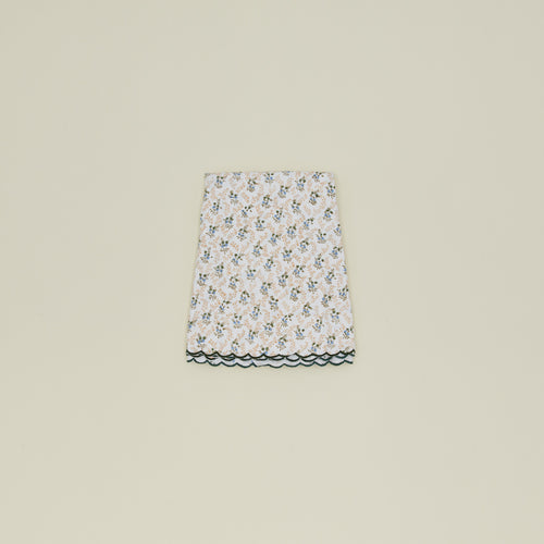 Little flowers round tablecloth in green.