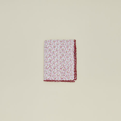 Little flowers rectangular tablecloth in maroon.