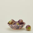 Splatter low bowl in pink and blue with peppers