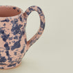 Close up view of Splatter mug in pink and blue