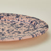 Close up view of Splatter pink and blue oval platter 
