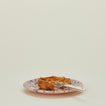 Splatter salad plate in pink and blue with cake
