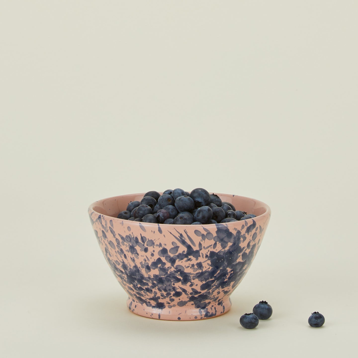 Splatter small bowl in pink and blue with blueberries