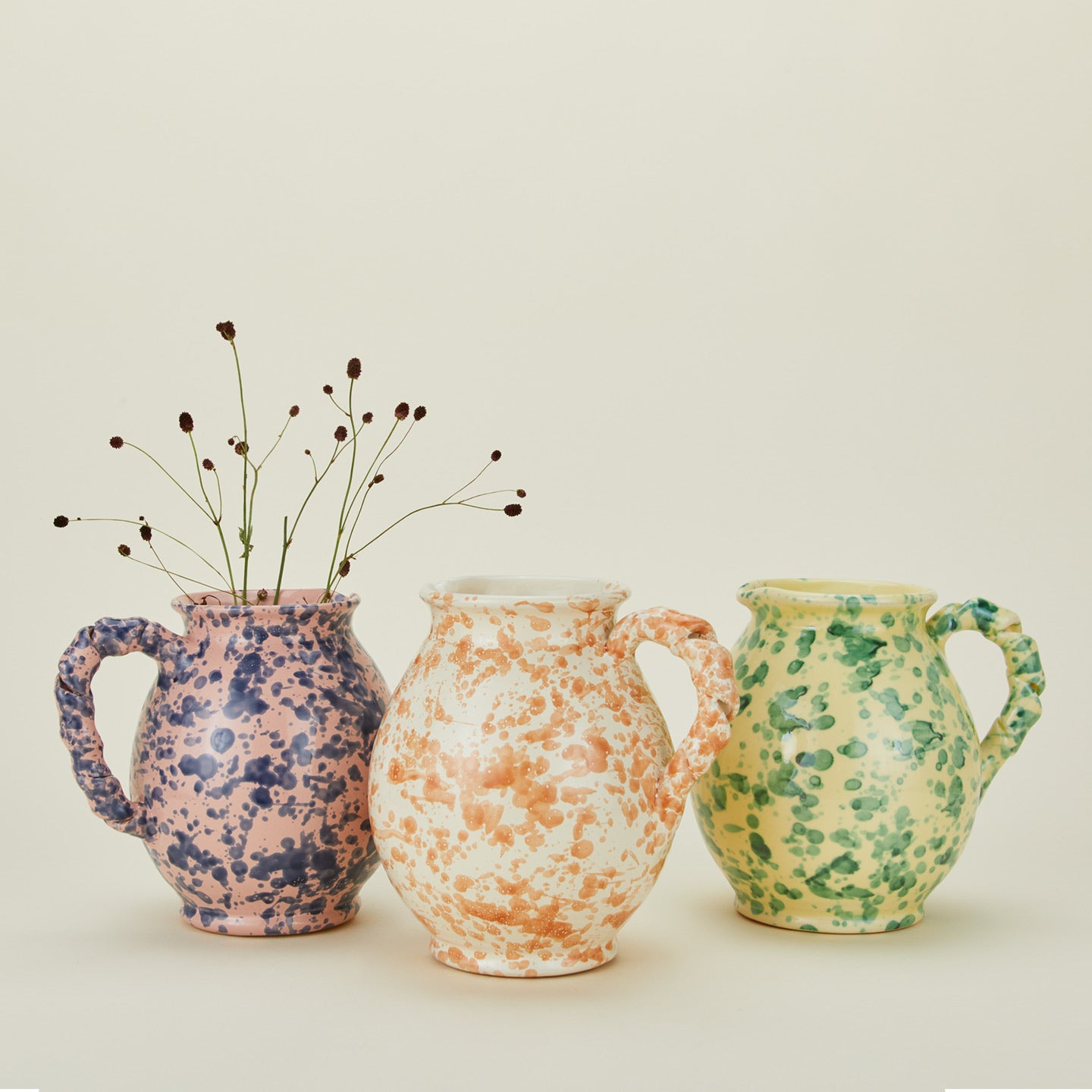 Cigno jugs in various colors with florals