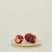 Splatter dinner plate in tan and ivory with peaches