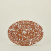 Splatter terracotta and ivory oval platter upright