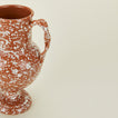 Close up view of Terracotta and ivory splatter verona vase