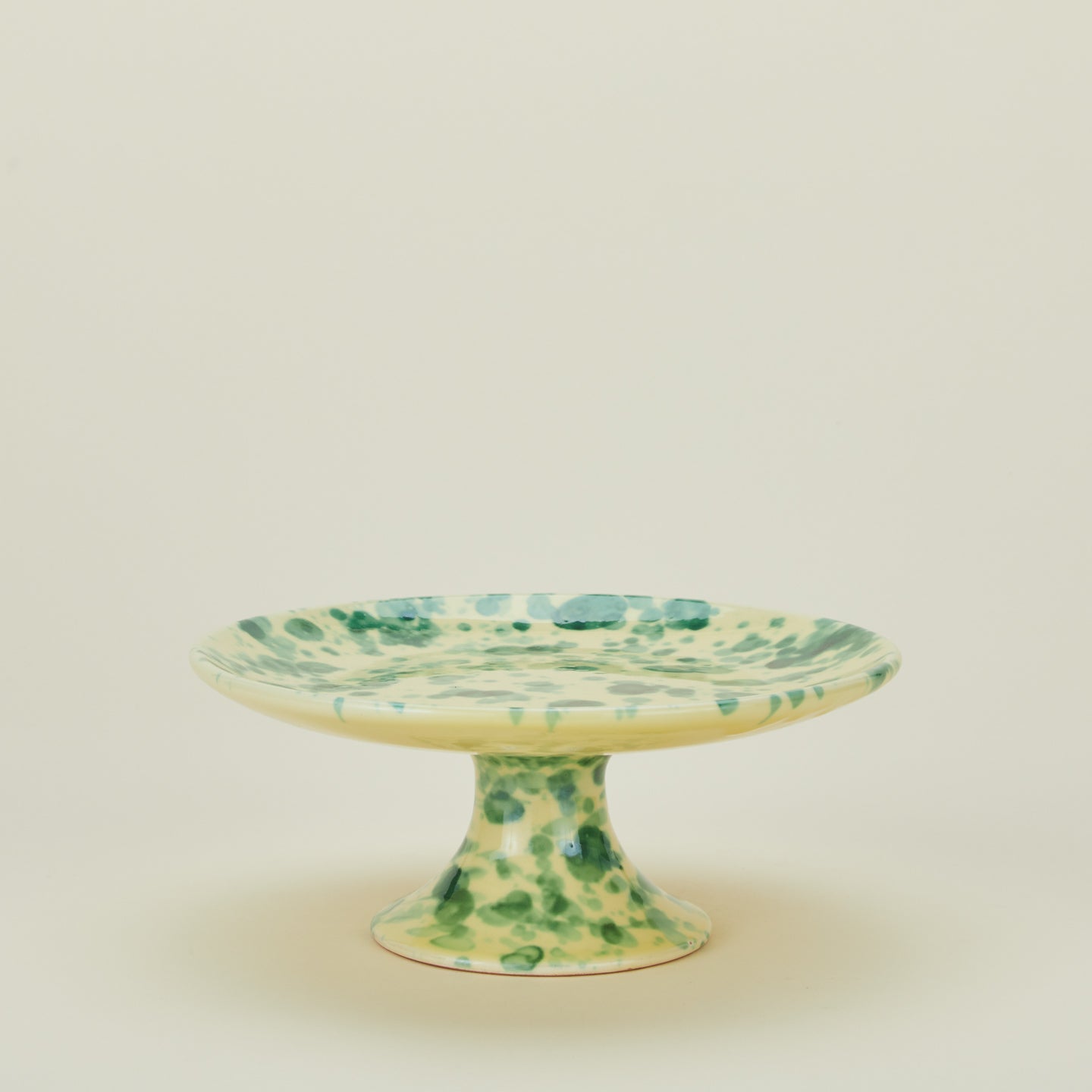 Splatter cake stand in yellow and green
