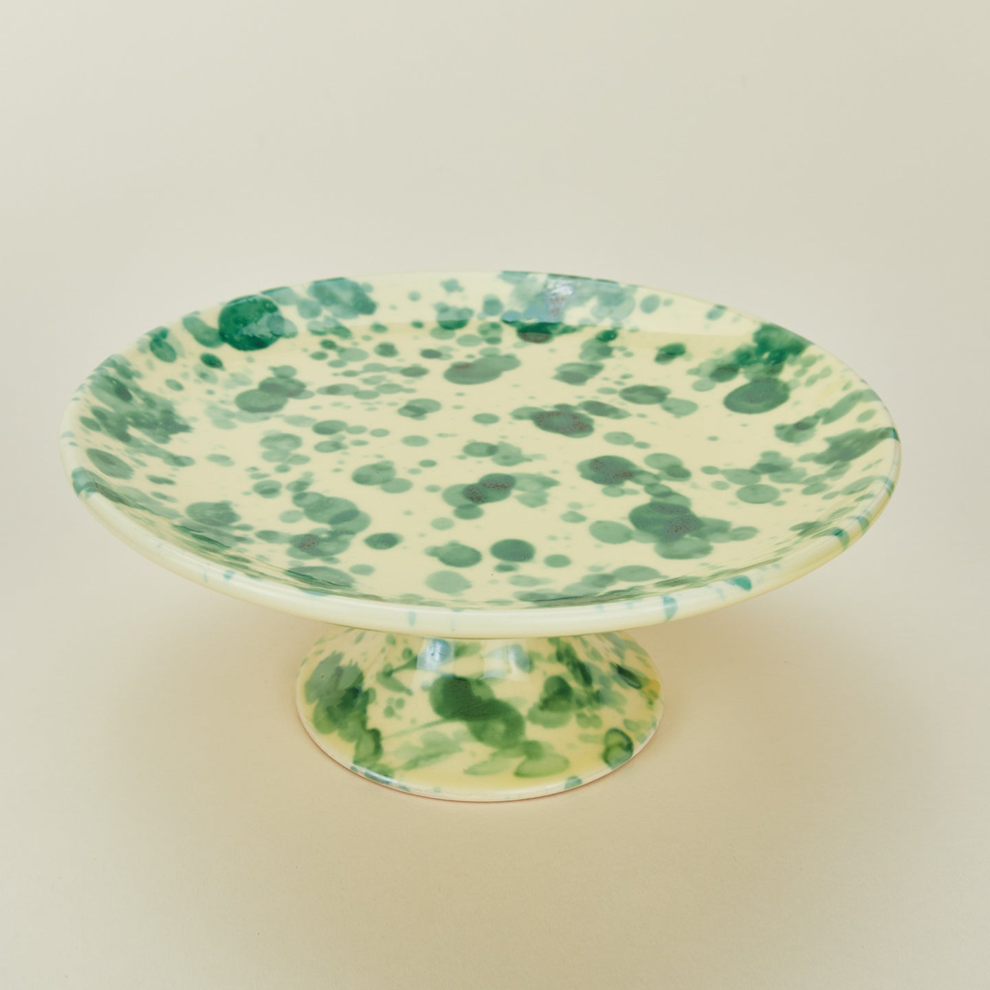 Splatter cake stand in yellow and green