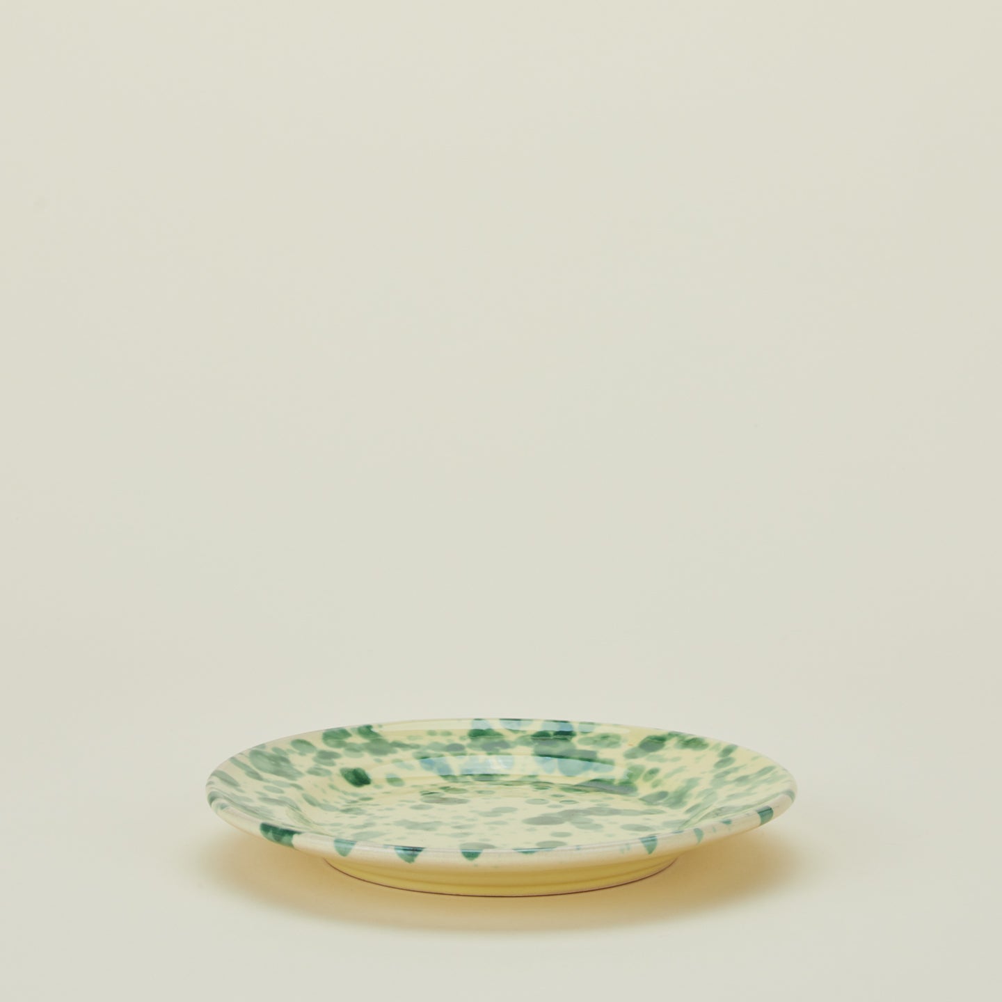 Splatter dinner plate in yellow and green
