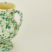Close up view of yellow and green verona vase 