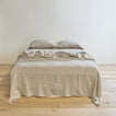 Simple linen bedding in ivory
