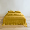 Simple linen bedding in mustard