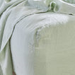 Simple linen bedding in sage
