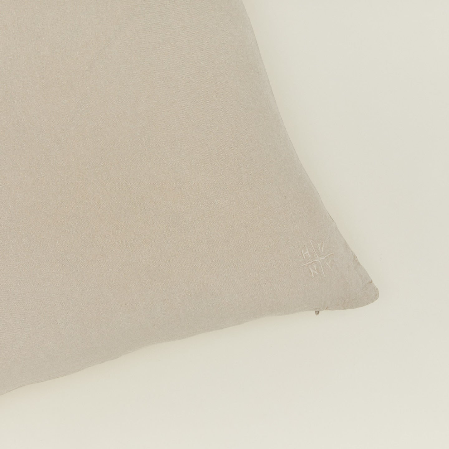 Close up view of simple linen pillow in flax