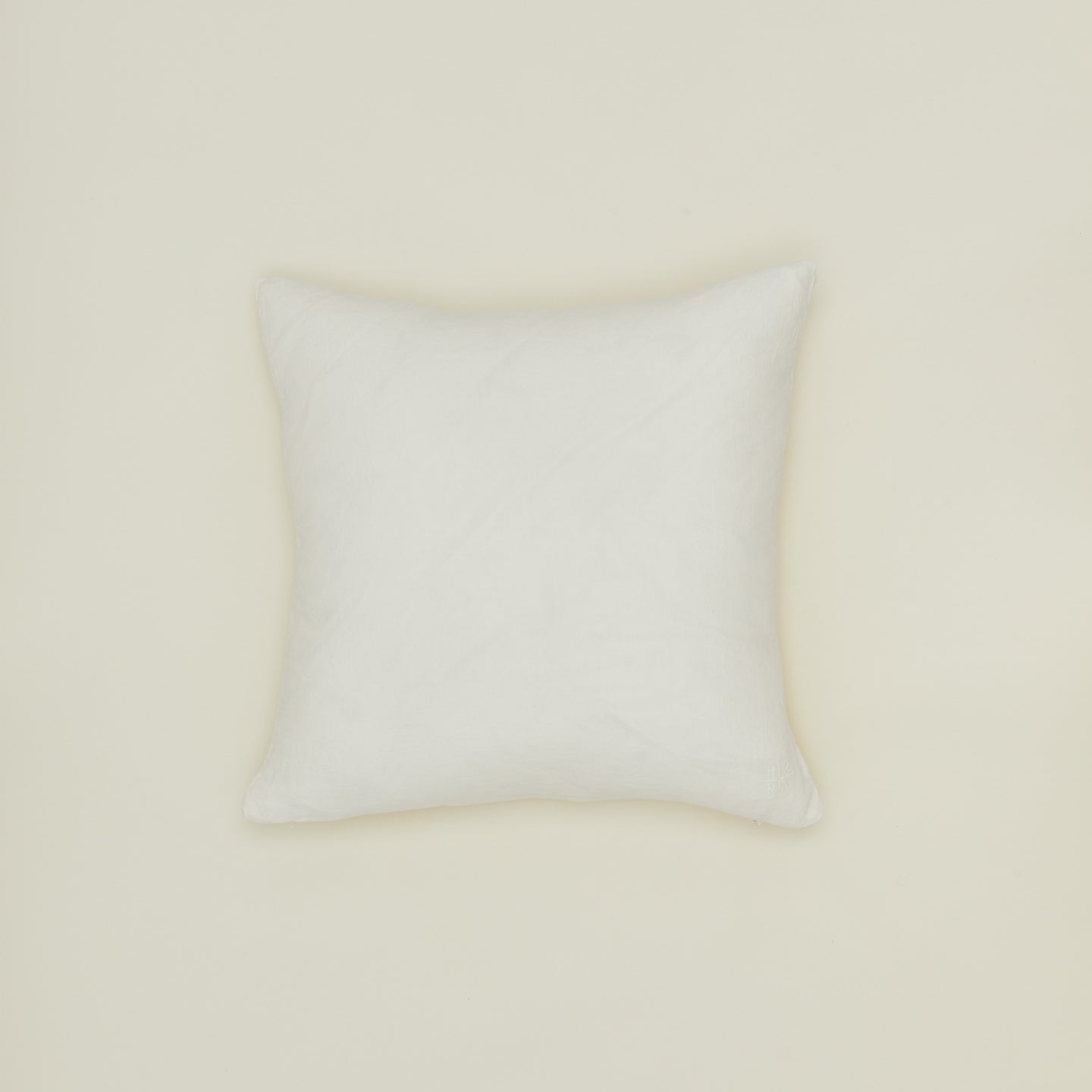 Simple linen pillow in ivory