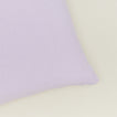 Close up of simple linen pillow in lilac