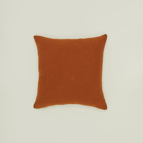 Simple linen pillow in terracotta
