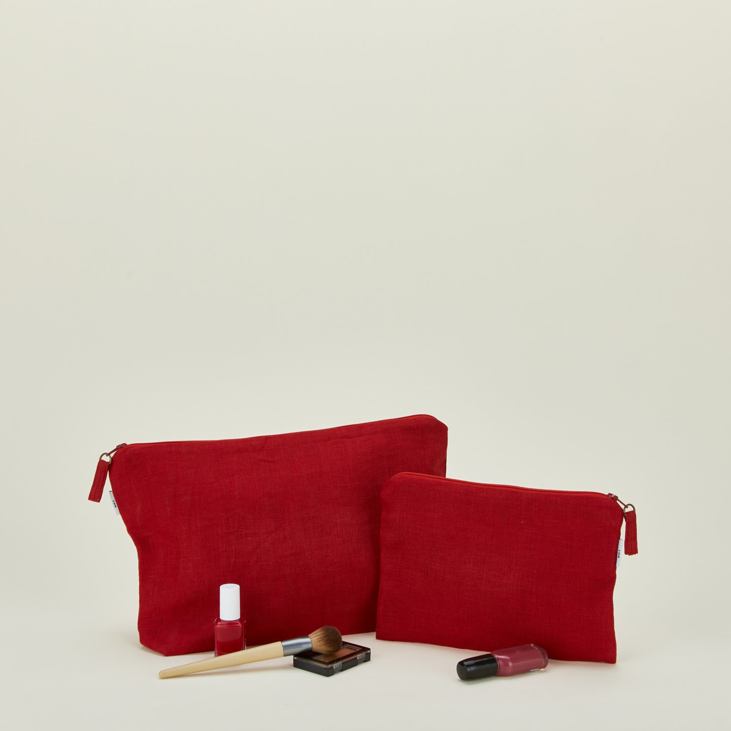 Simple linen zipper pouches in red with cosmetics