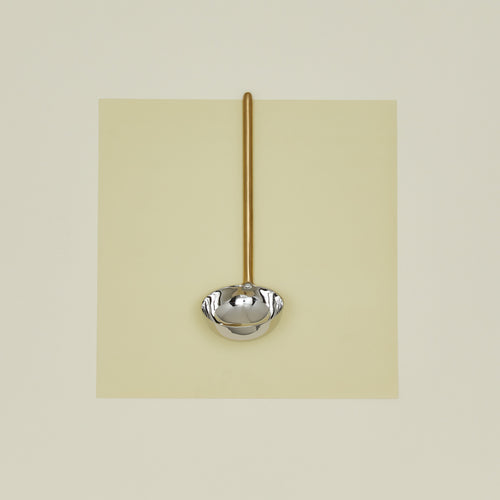 Simple metal ladle in brass