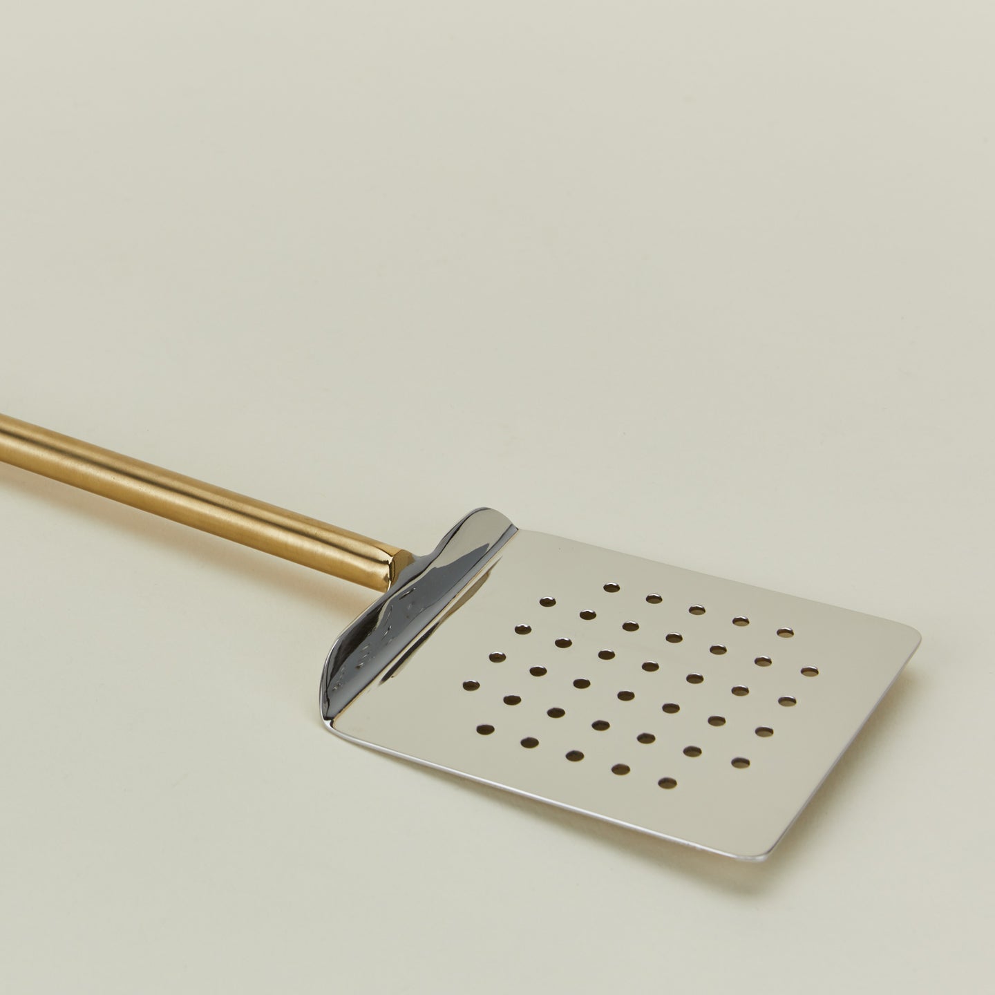 Close up view of Simple metal spatula in brass