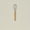 Simple metal whisk in brass