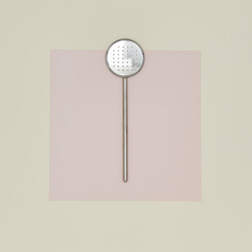 Simple metal flat slotted spoon in silver