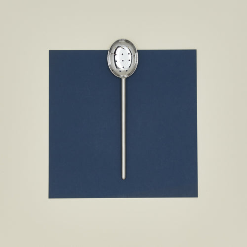 Simple metal slotted spoon in silver