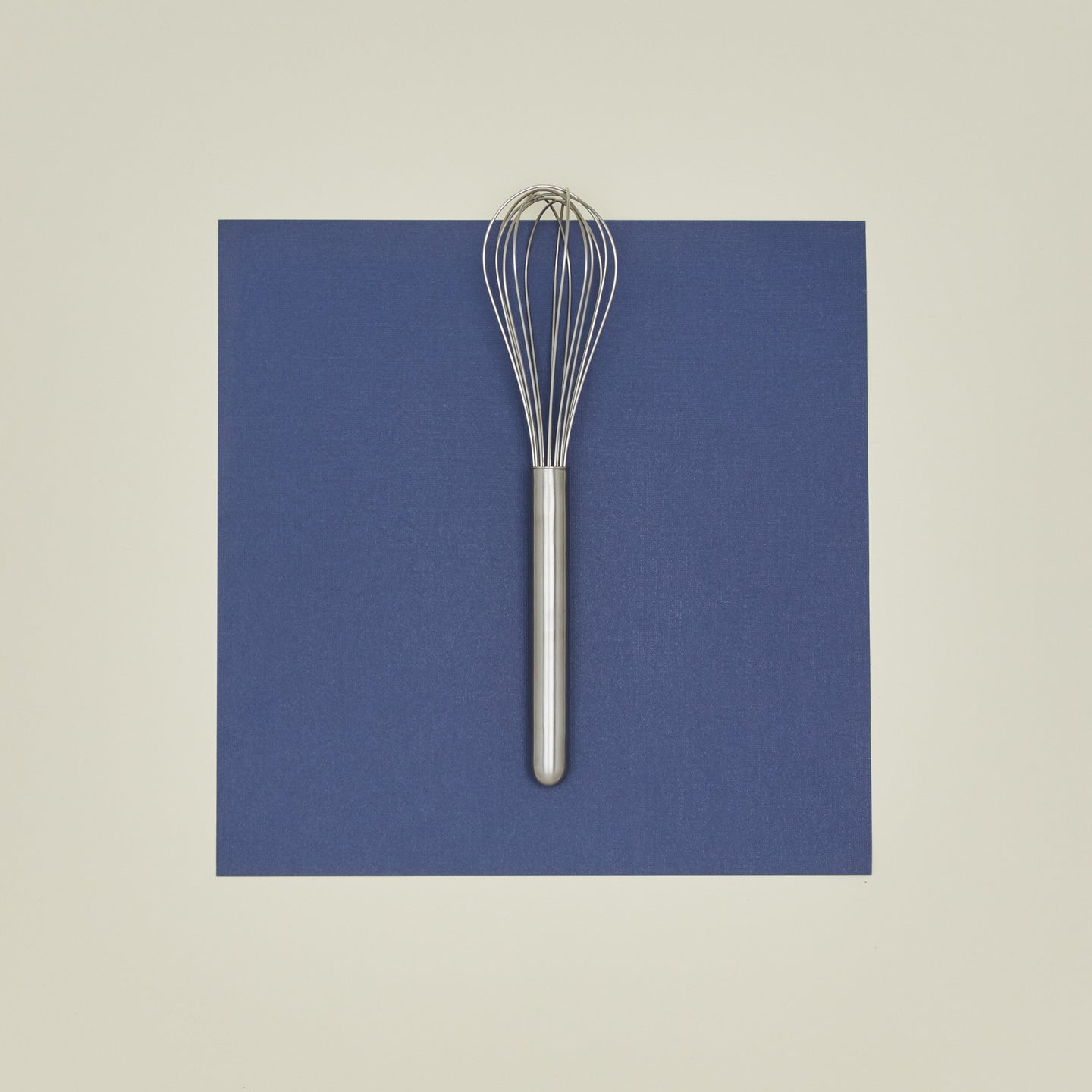 Simple metal whisk in silver