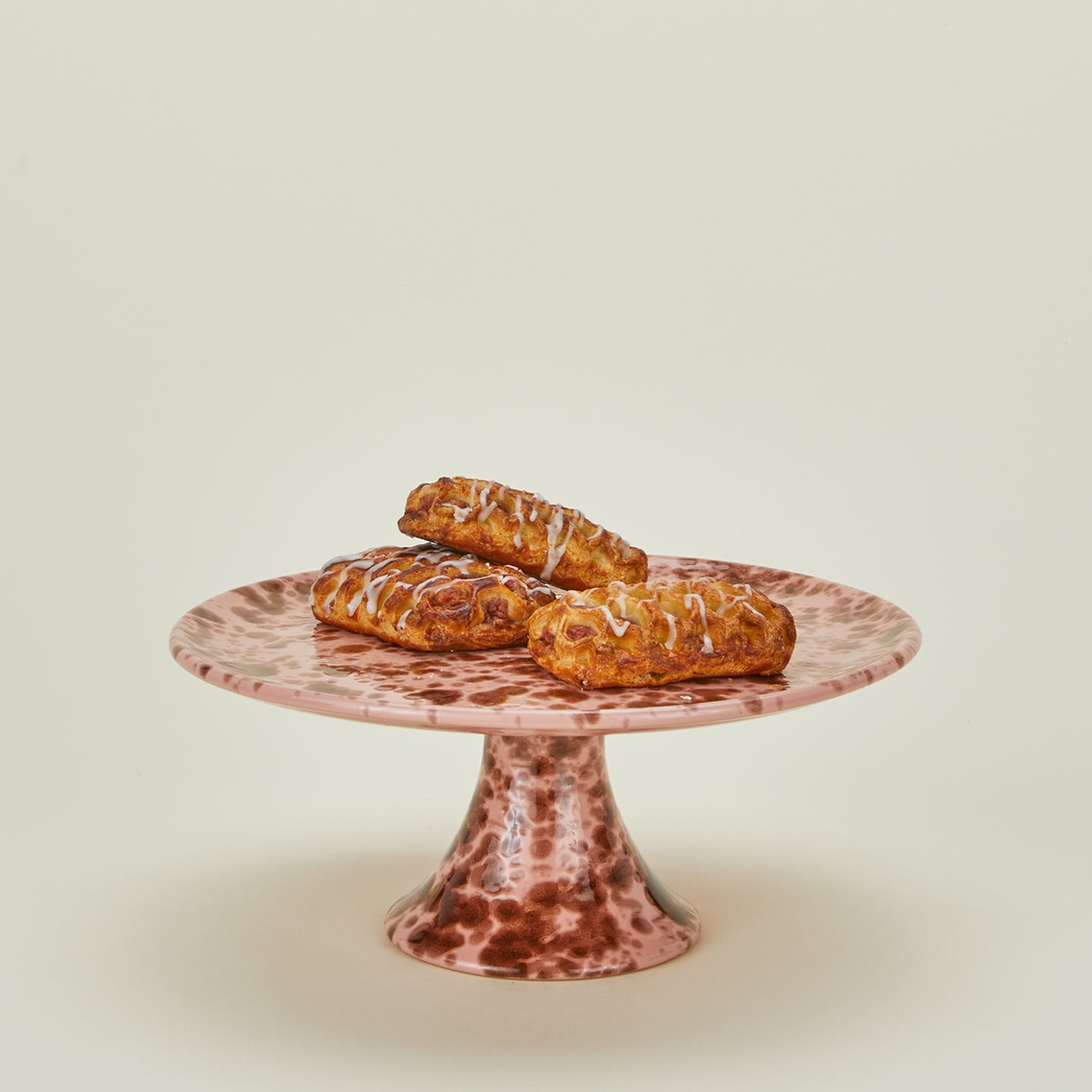 Splatterware cake stand in blush and terracotta and baked goods