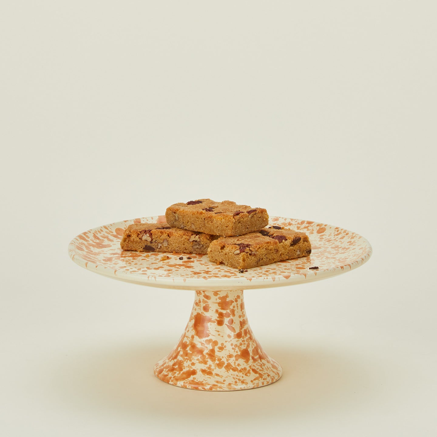 Splatterware cake stand in ivory and bronze with brownies