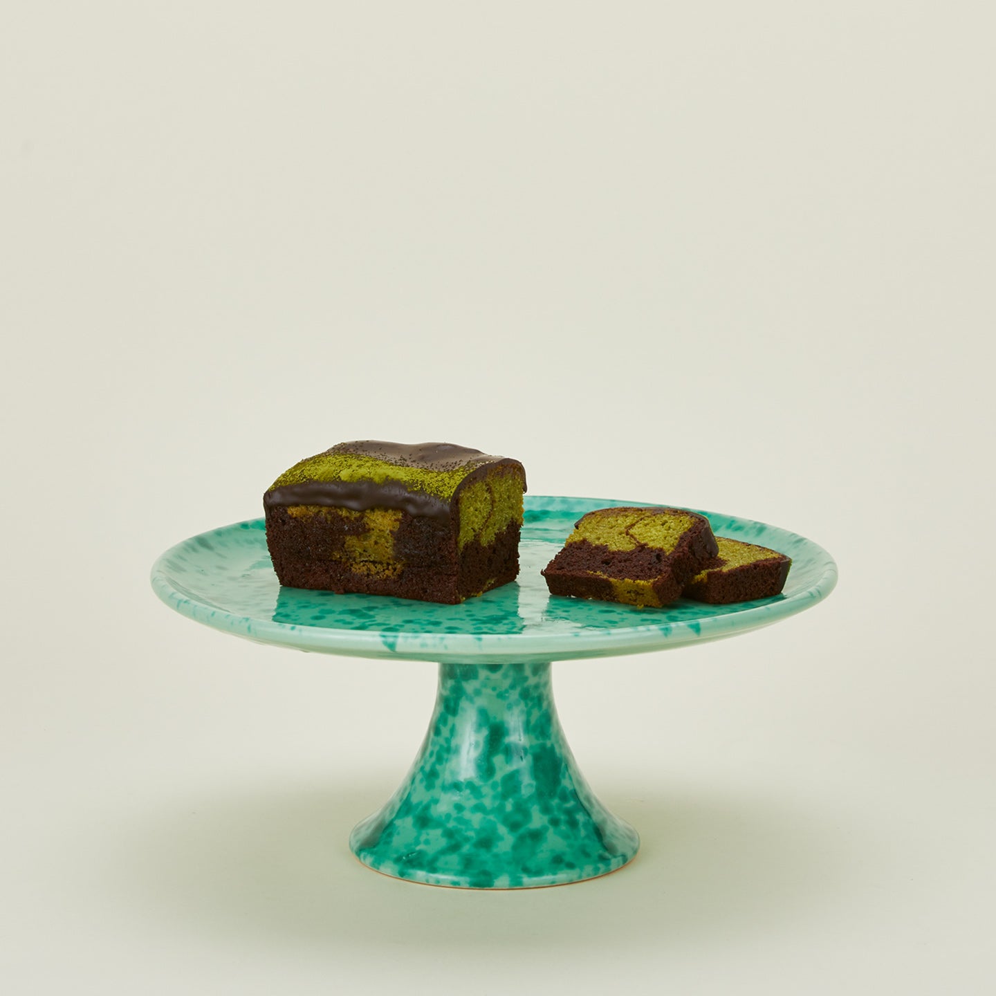 Splatterware cake stand in sage and green with baked goods