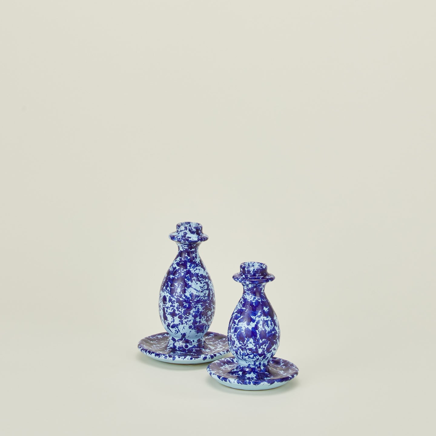 Large and small splatter candle stick holders in sky and cobalt