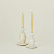 Splatterware candlestick holders in ivory and white with candles