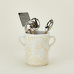 Splatterware crock in white and ivory with kitchen utensils