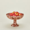 Splatterware footed bowl in blush and terracotta with apples