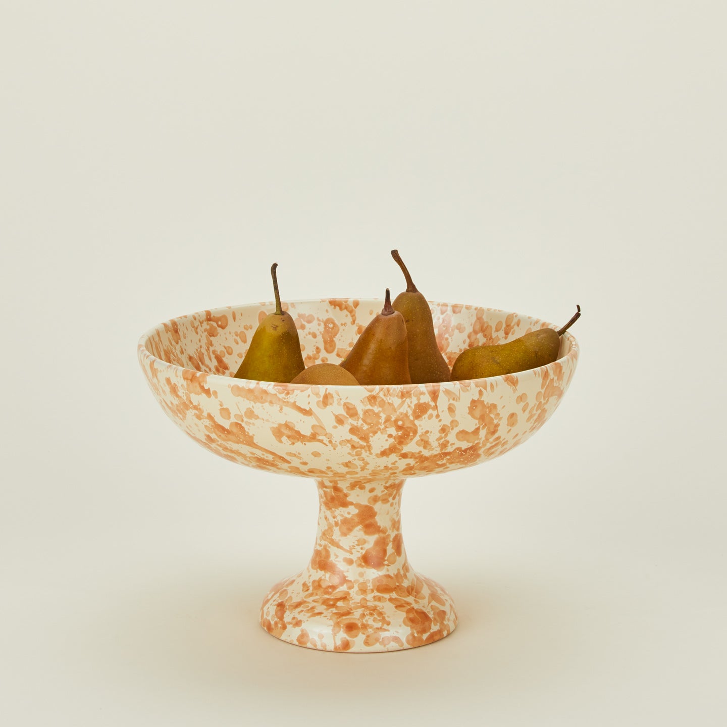 Splatterware footed bowl in ivory and bronze with pears