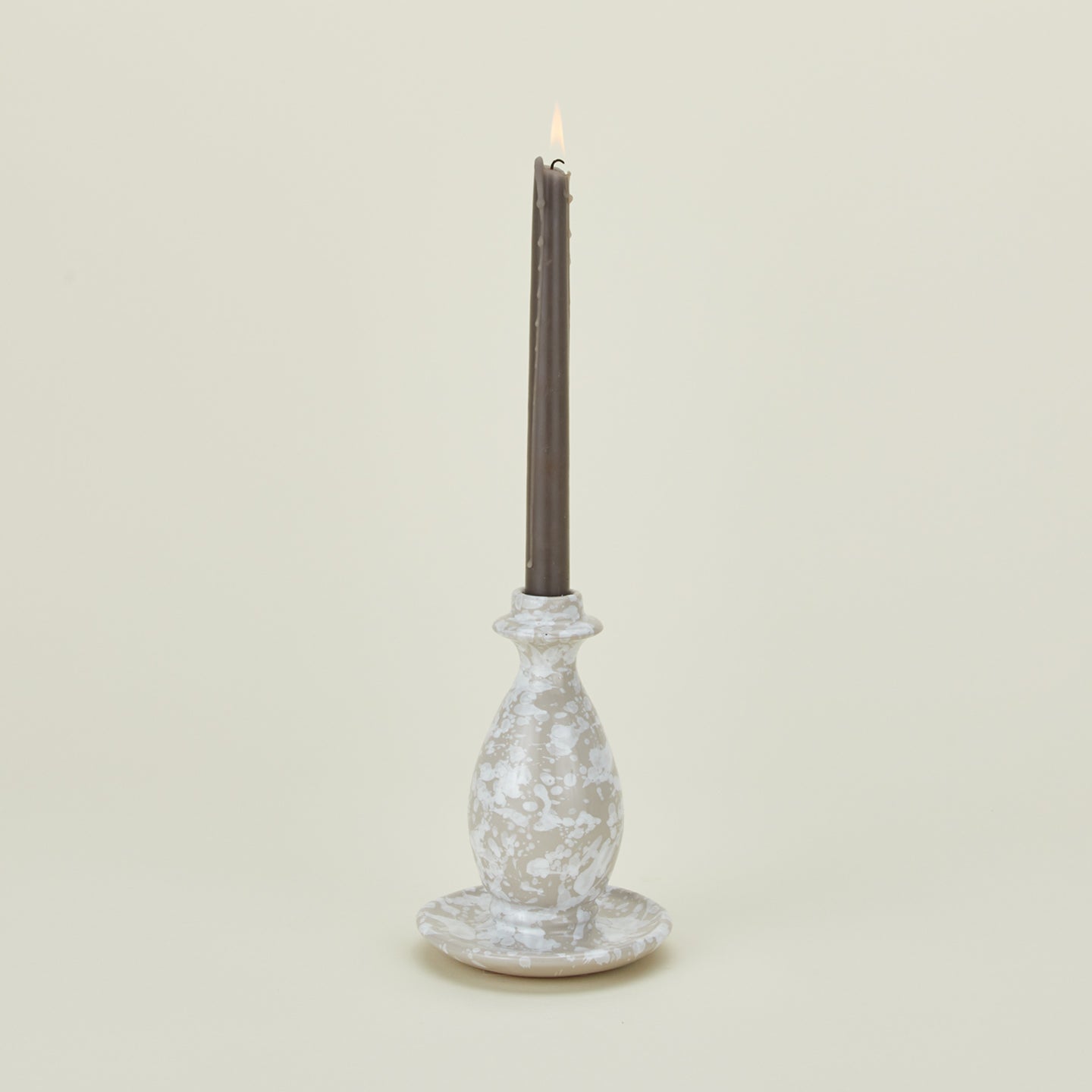 Large splatterware candlestick holder in white and grey with candle