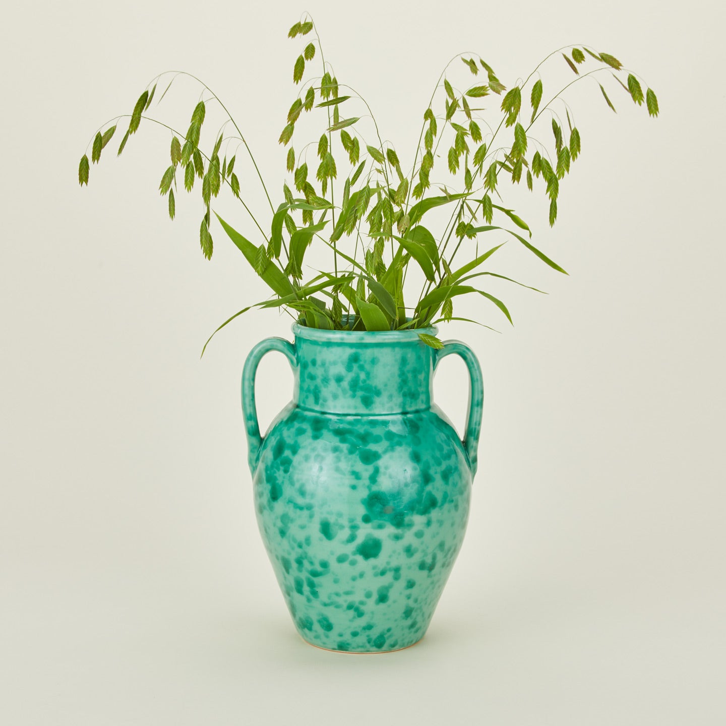 Large splatterware vase in sage and green with florals