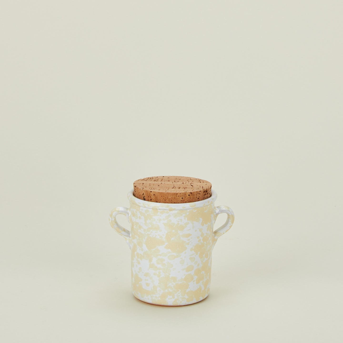 Splatterware salt cellar in ivory and white with cork top
