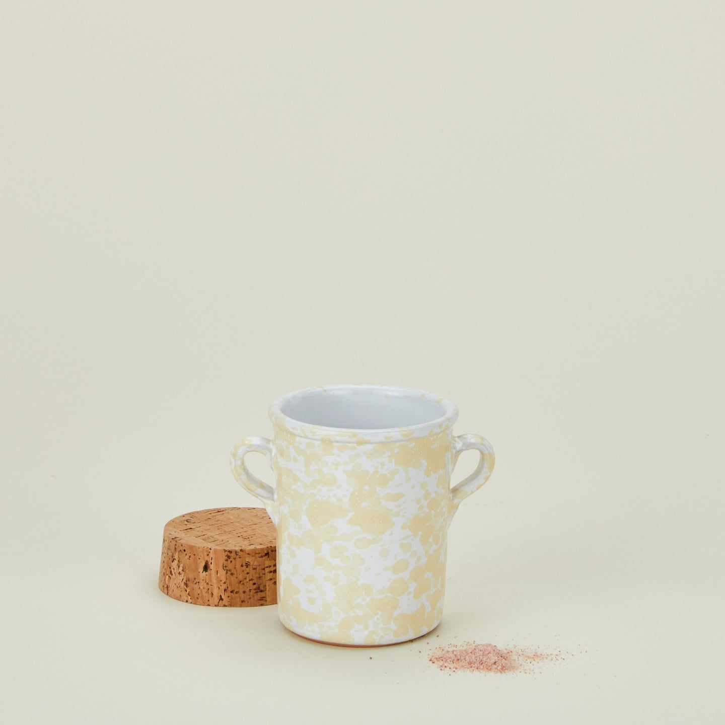 Splatterware salt cellar in ivory and white with cork top with salt