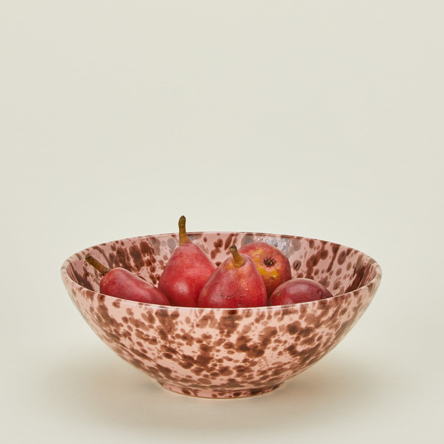 Splatterware serving bowl in blush and terracotta with apples