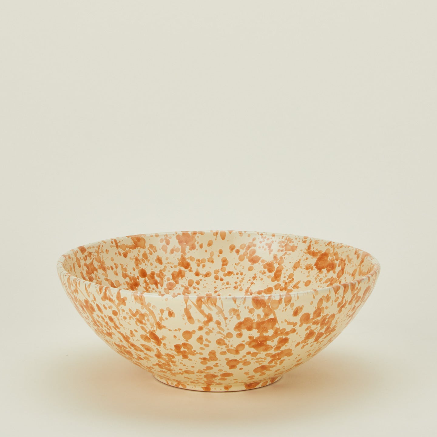 Splatterware serving bowl in ivory and bronze