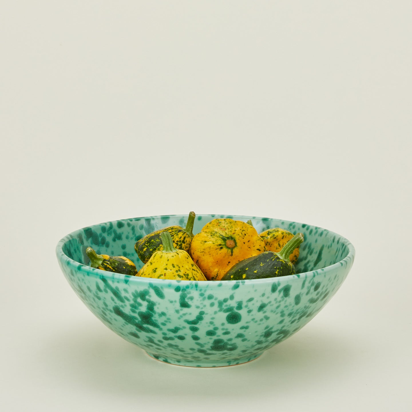 Splatterware serving bowl in sage and green with squash