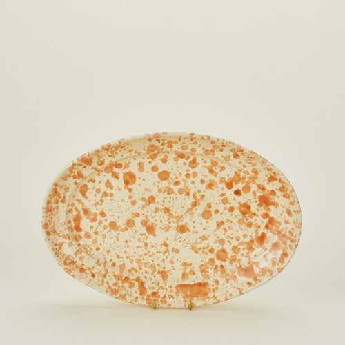Splatterware serving platter in ivory and bronze
