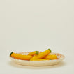 Splatterware serving platter in ivory and bronze with squash